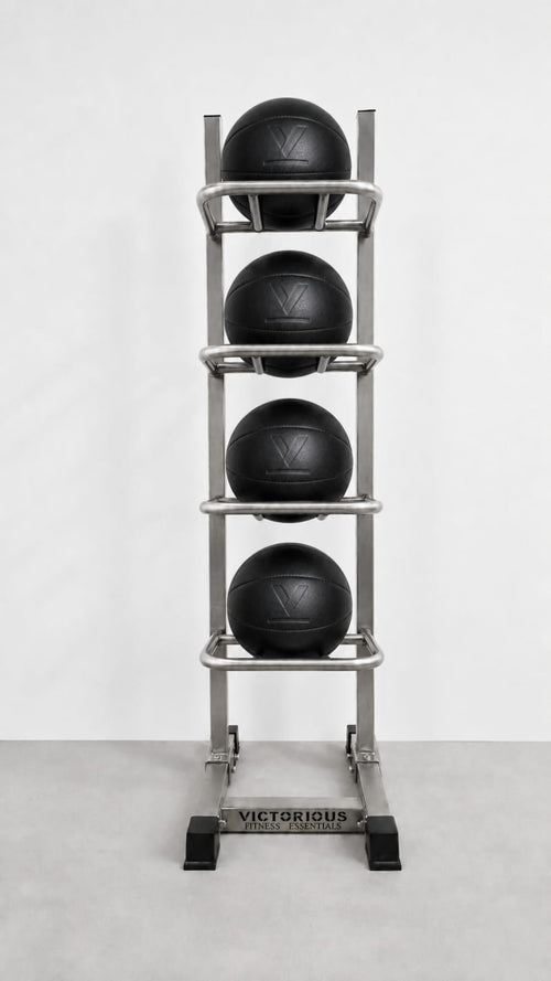 A stainless steel 4-tier medicine ball rack holding four black medicine balls.